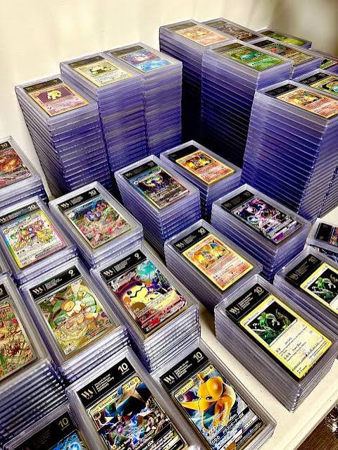 Stacks of graded Pokémon card slabs, including PSA 10s, lined up in the vault